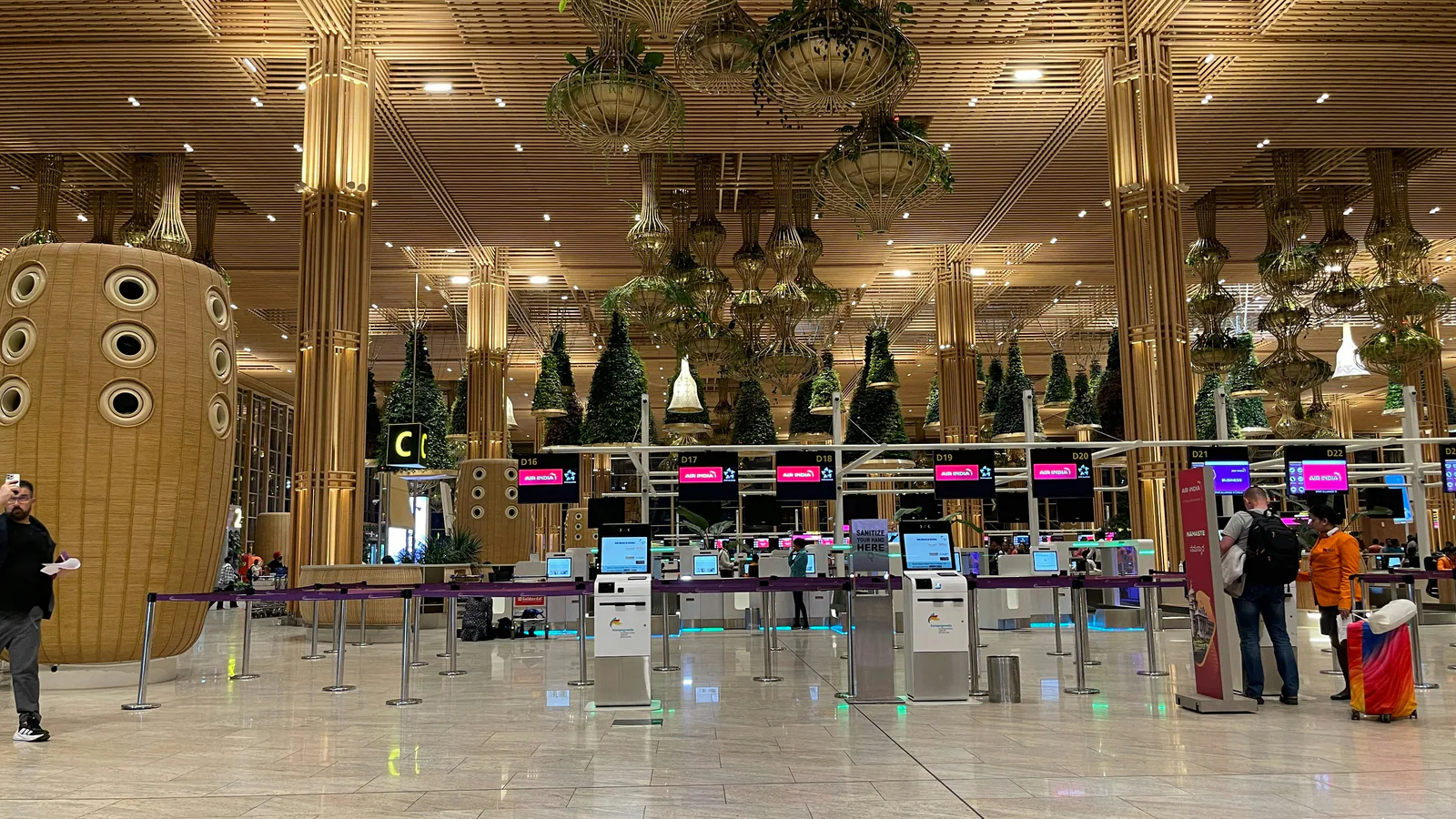 Airport terminal interior with check-in counters, representing corridor movement and operating flow.