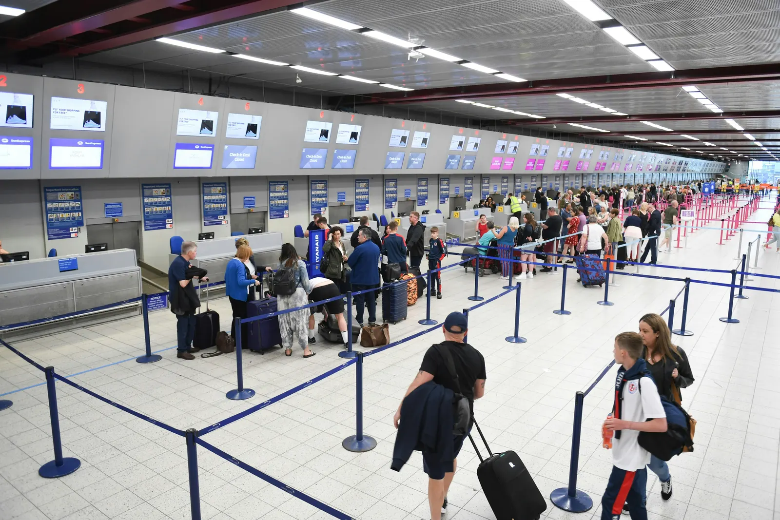 Airport terminal with travelers, representing global operating flow.