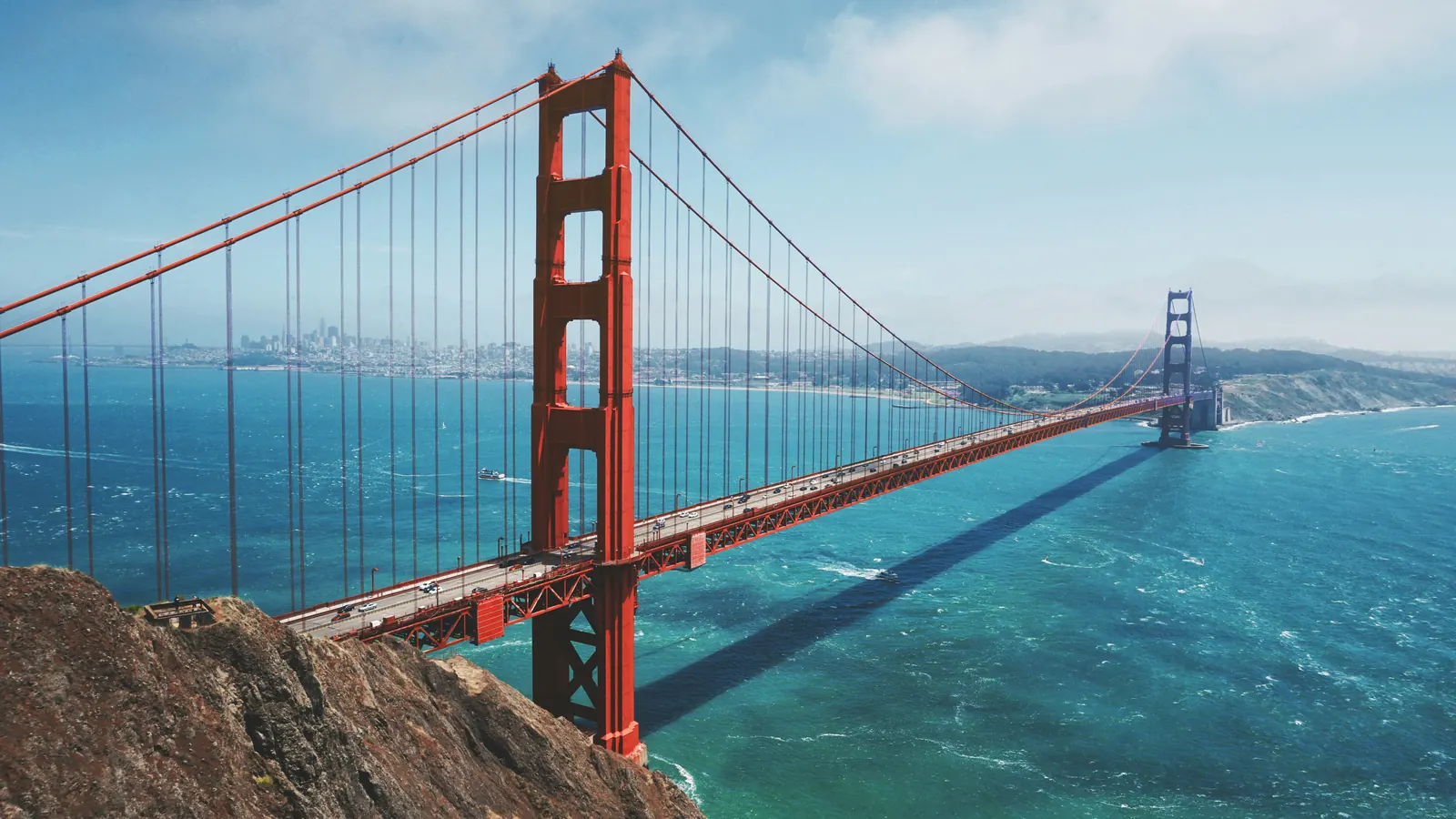 Golden Gate Bridge over water, representing U.S. market connection and corridor movement.