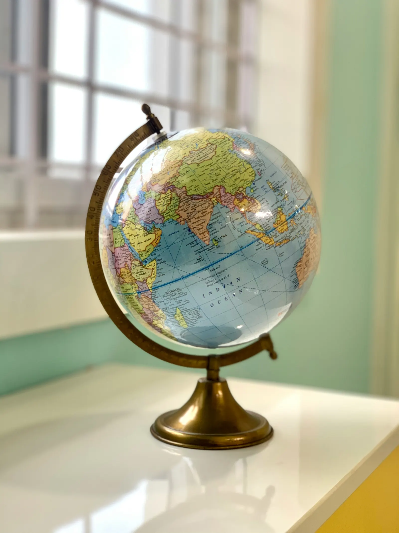 Globe on a desk, representing India as a strategic execution corridor.