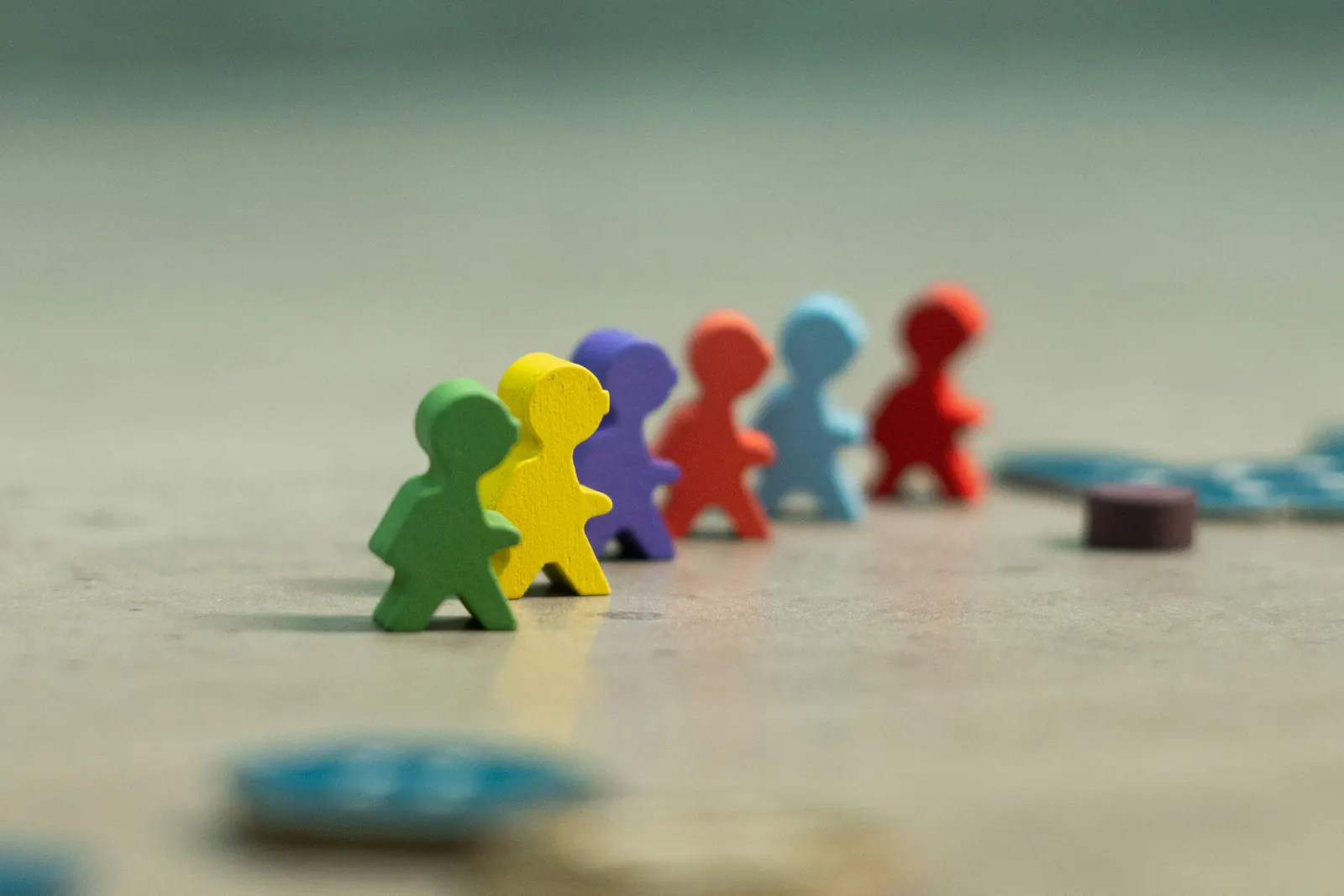 Colorful figures moving in sequence, representing people performance and leadership progression.
