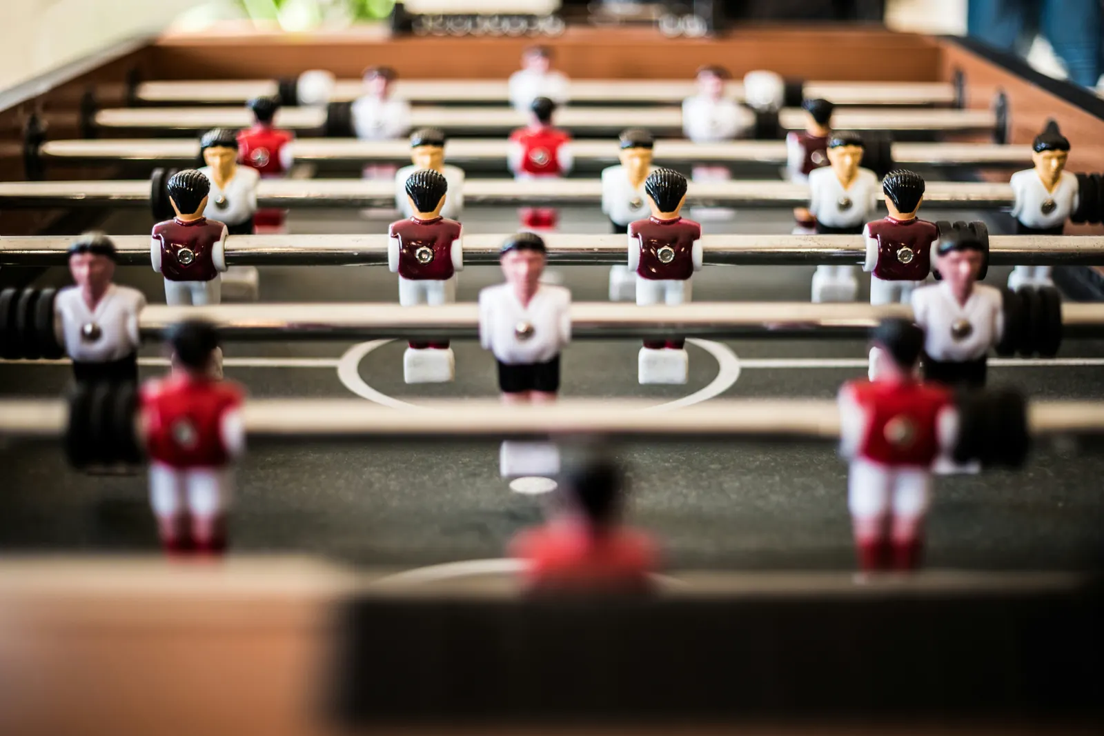 Table game players in formation, representing team strategy and coordinated action.