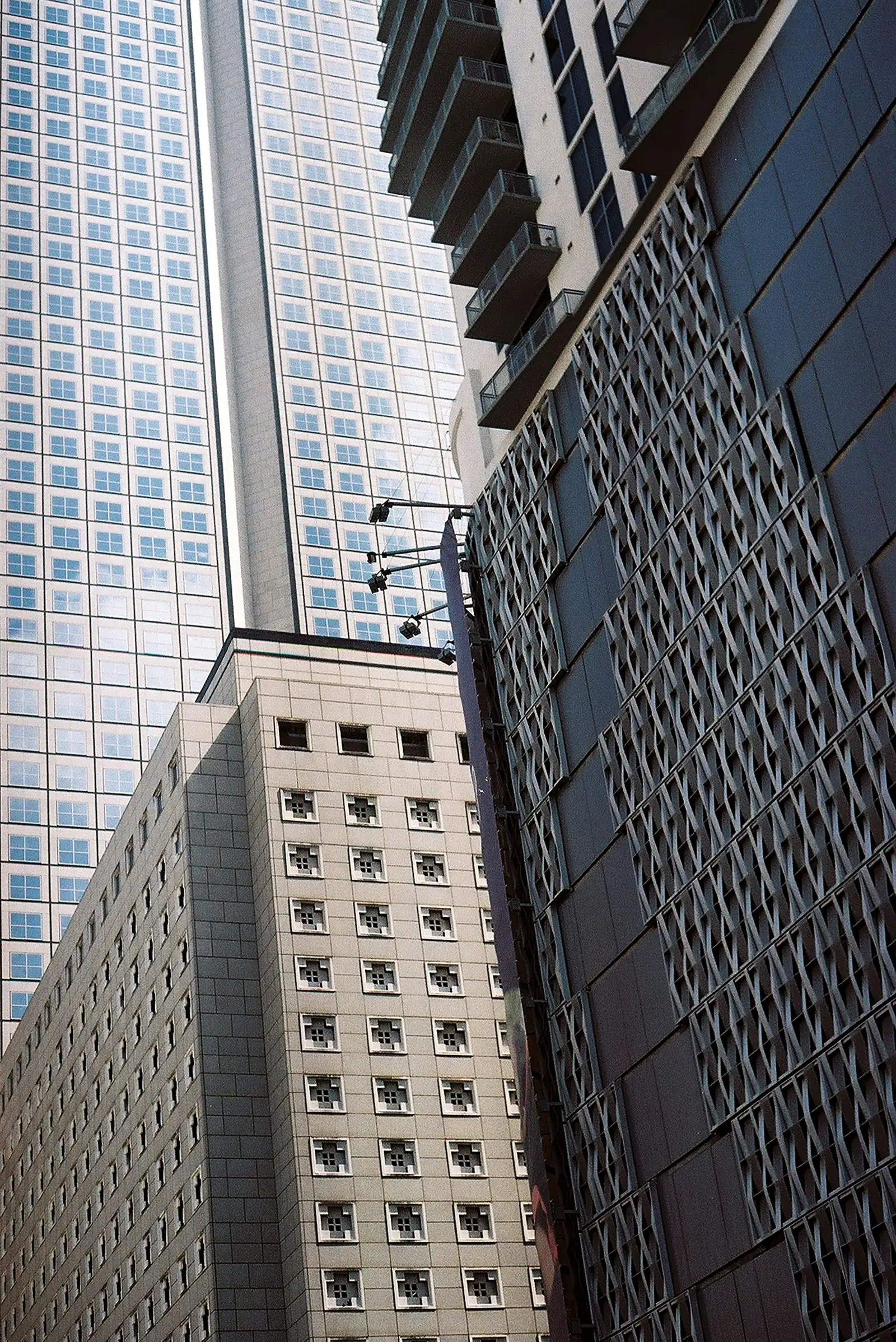 Tall U.S. office towers seen from street level, representing sponsor-side enterprise context.